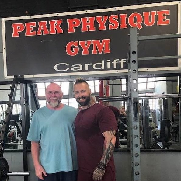 The Peak Physique Gym Cardiff sign above a squat rack